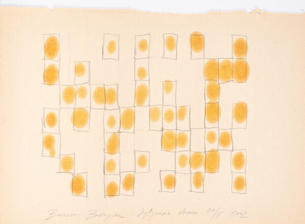 Papier pokryty olejnymi plamkami w prostokątnych polach