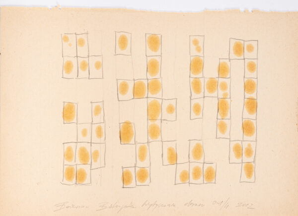 Papier pokryty olejnymi plamkami w prostokątnych polach